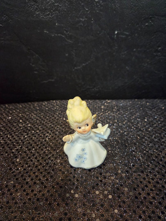 Vintage Angel holding a dove