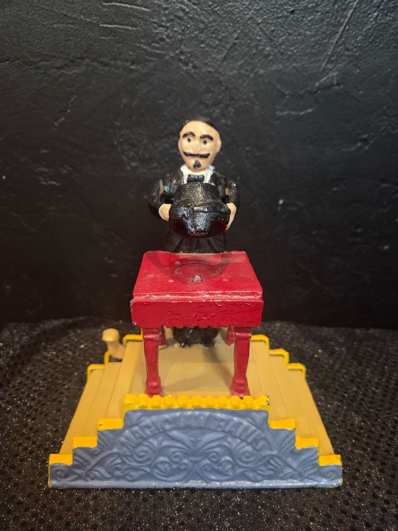 Vintage Magician Cast Iron Coin Bank