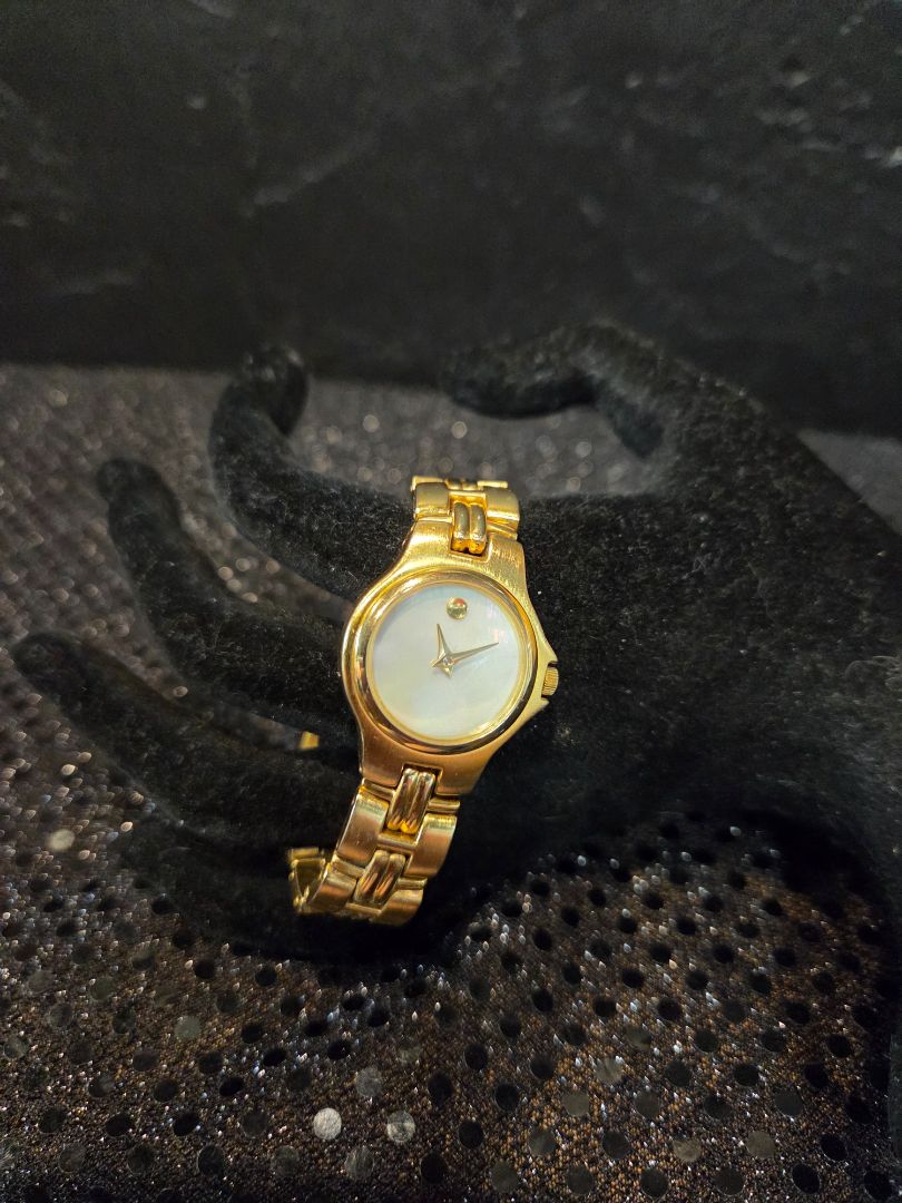 Gold Tone Watch with Mother of Peal face