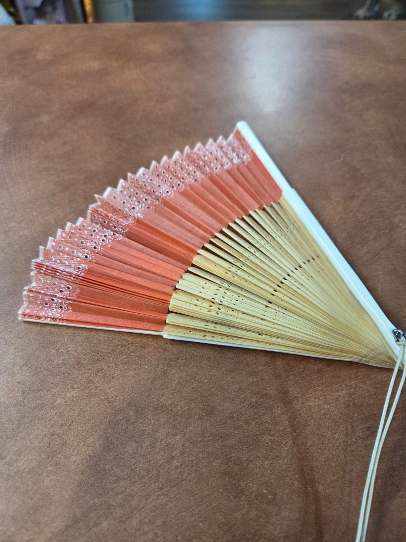 Pink fabric and wood Fan