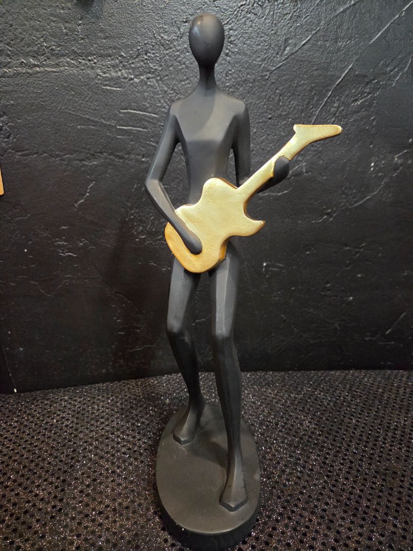 Matte Black and Gold Guitarist