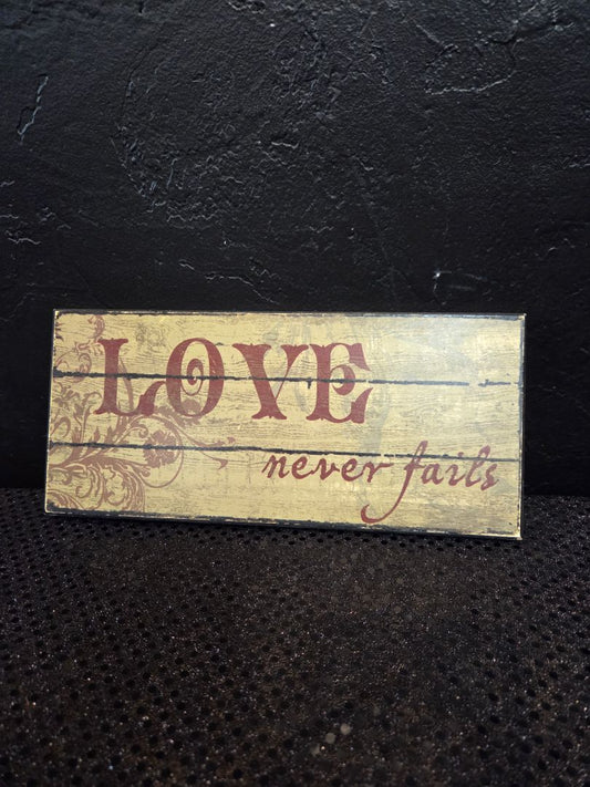 Love never fails Sign