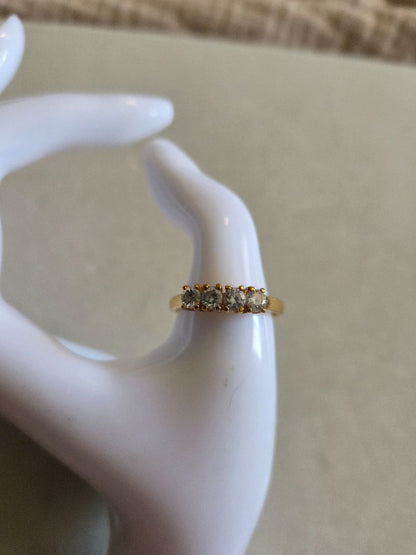 Gold tone 4 Rhinestone ring marked Korea size 8.75