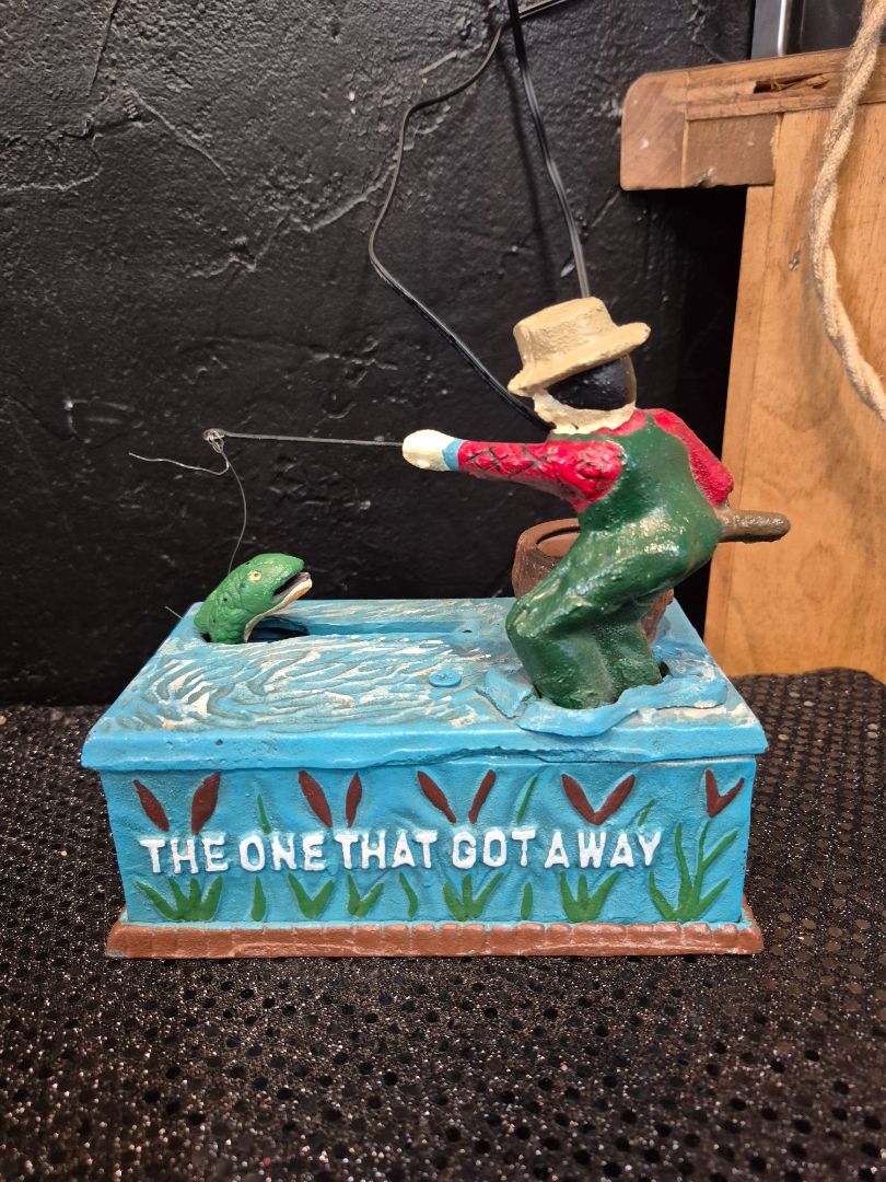 Vintage Cast Iron Mechanical Coin Bank " The One That Got Away", 7" × 6.5" × 4"