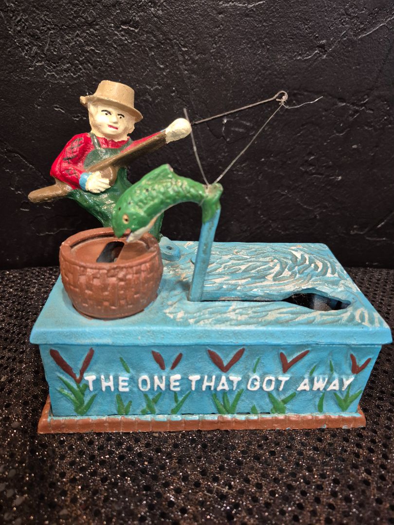 Vintage Cast Iron Mechanical Coin Bank " The One That Got Away", 7" × 6.5" × 4"
