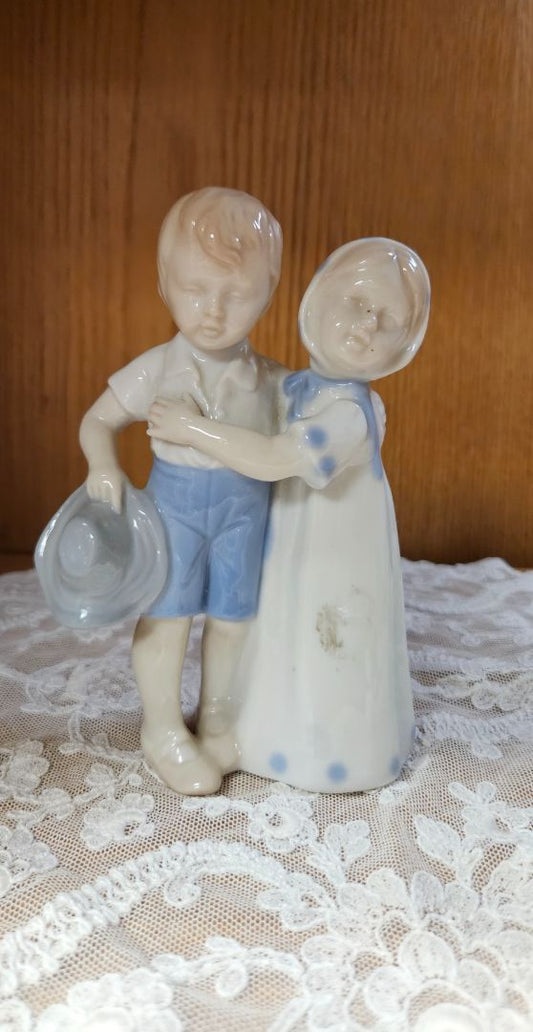 Vintage porcelain boy and girl LR