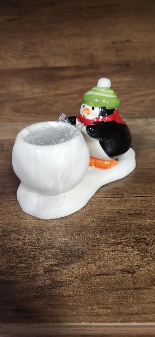 Ceramic penguin candle holder