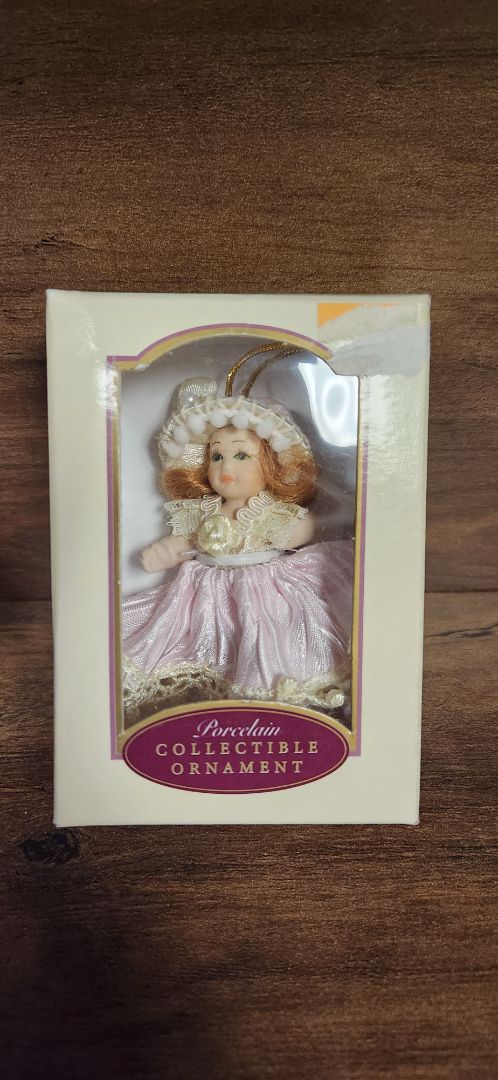 Porcelain collectible doll ornament - pink dress
