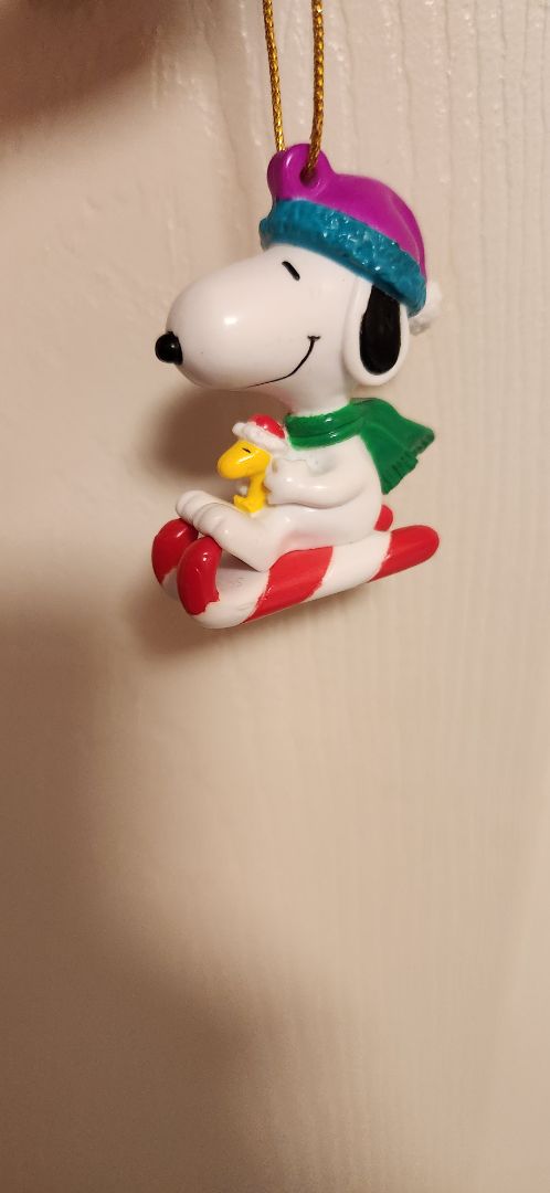 Charles Schultz Snoopy & woodstock on candycane sled ornament
