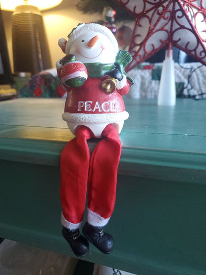 Ledge sitting snowman