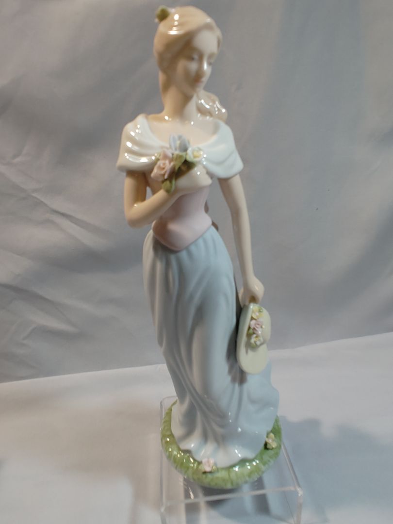 Blue, Pink, White Pastels Avon Avon Moments & Memories "A Spring Stroll" porcelain figurine Figurine, 9"
