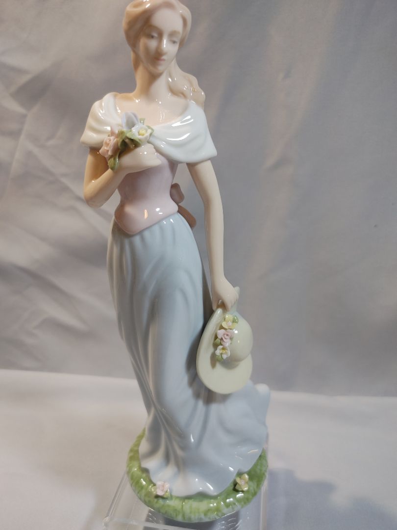Blue, Pink, White Pastels Avon Avon Moments & Memories "A Spring Stroll" porcelain figurine Figurine, 9"