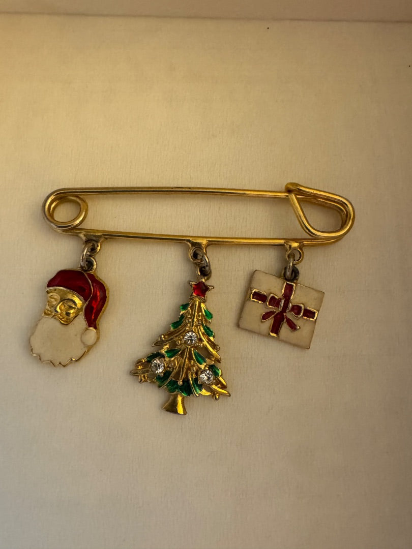 H-Avon Goldtone safety pin with charms