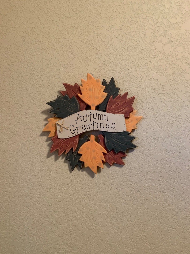 Fall colors  Autumn greetings Wooden wreath with wood leaves