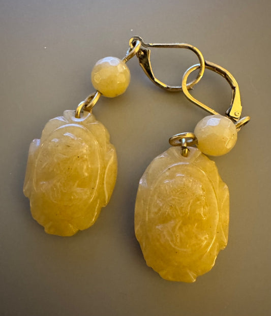 Carved ivorycolor earrings