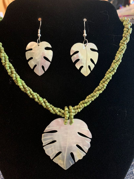 green and white  monstera shell with green beaded necklace and earring set