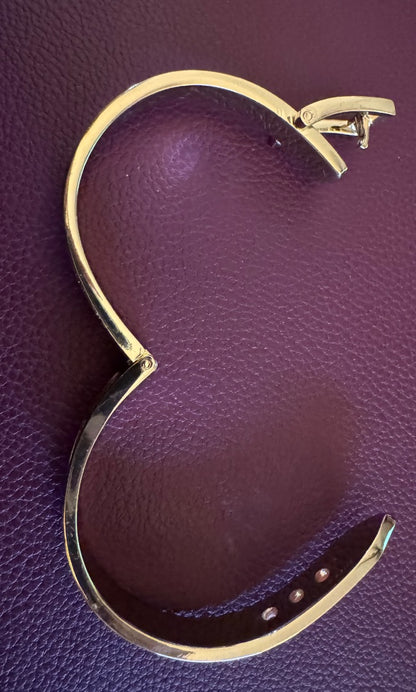 Gold tone buckle hinged stardust bracelet