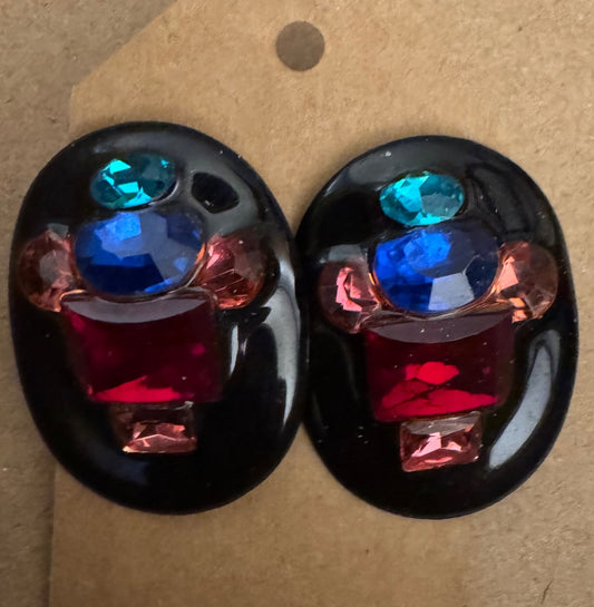 Blackplastic multi color stud earrings