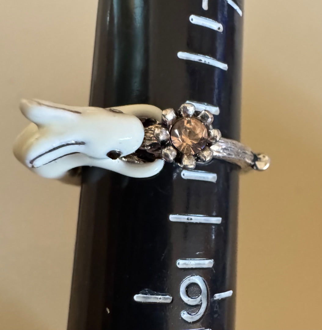 White rabbit holding flower ring 8