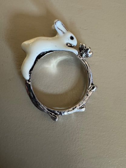 White rabbit holding flower ring 8