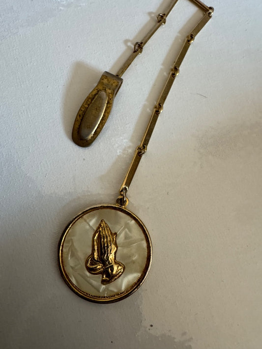 Praying hands gold tone clip