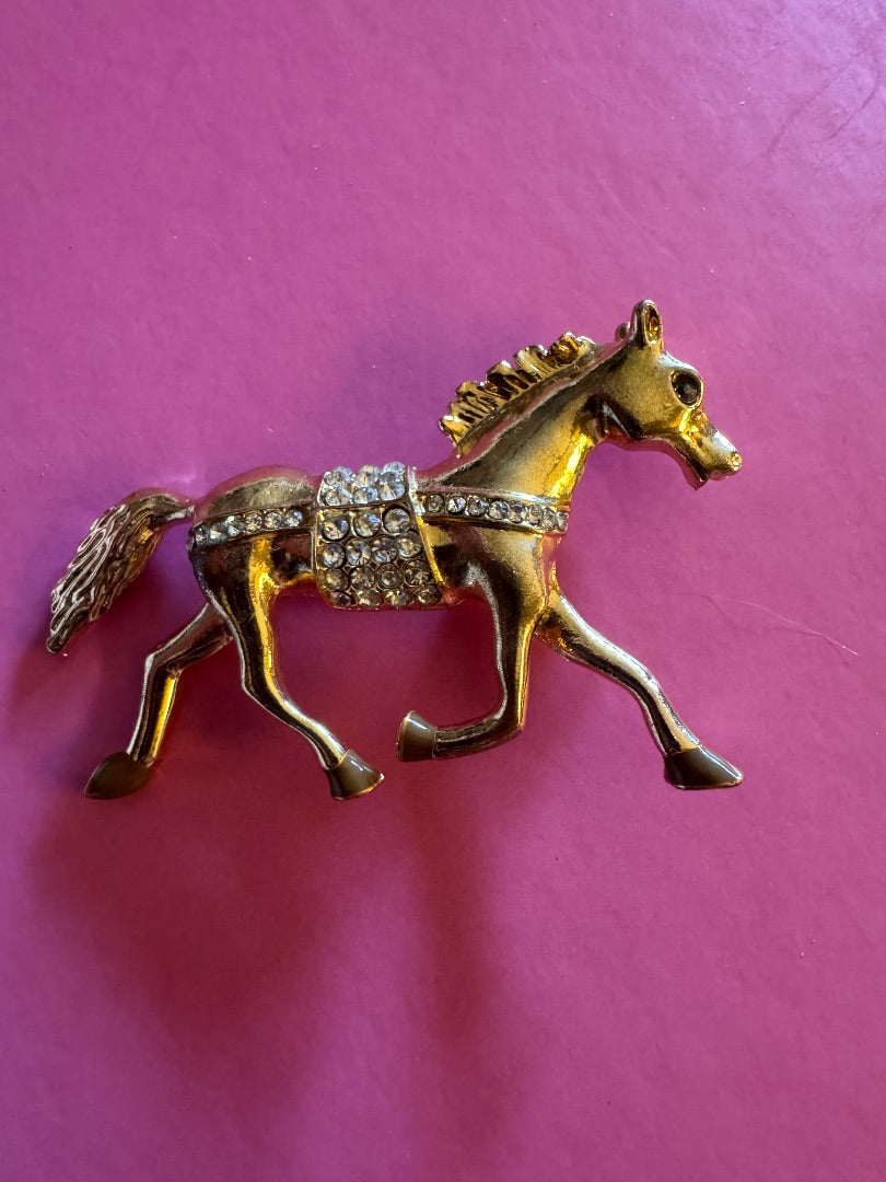 Trotting gold tone horse brooch