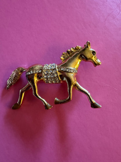 Trotting gold tone horse brooch