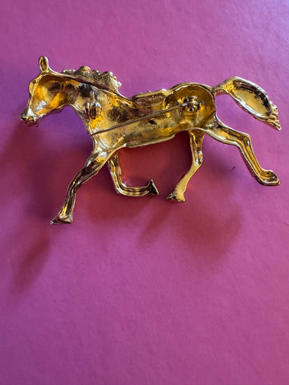 Trotting gold tone horse brooch