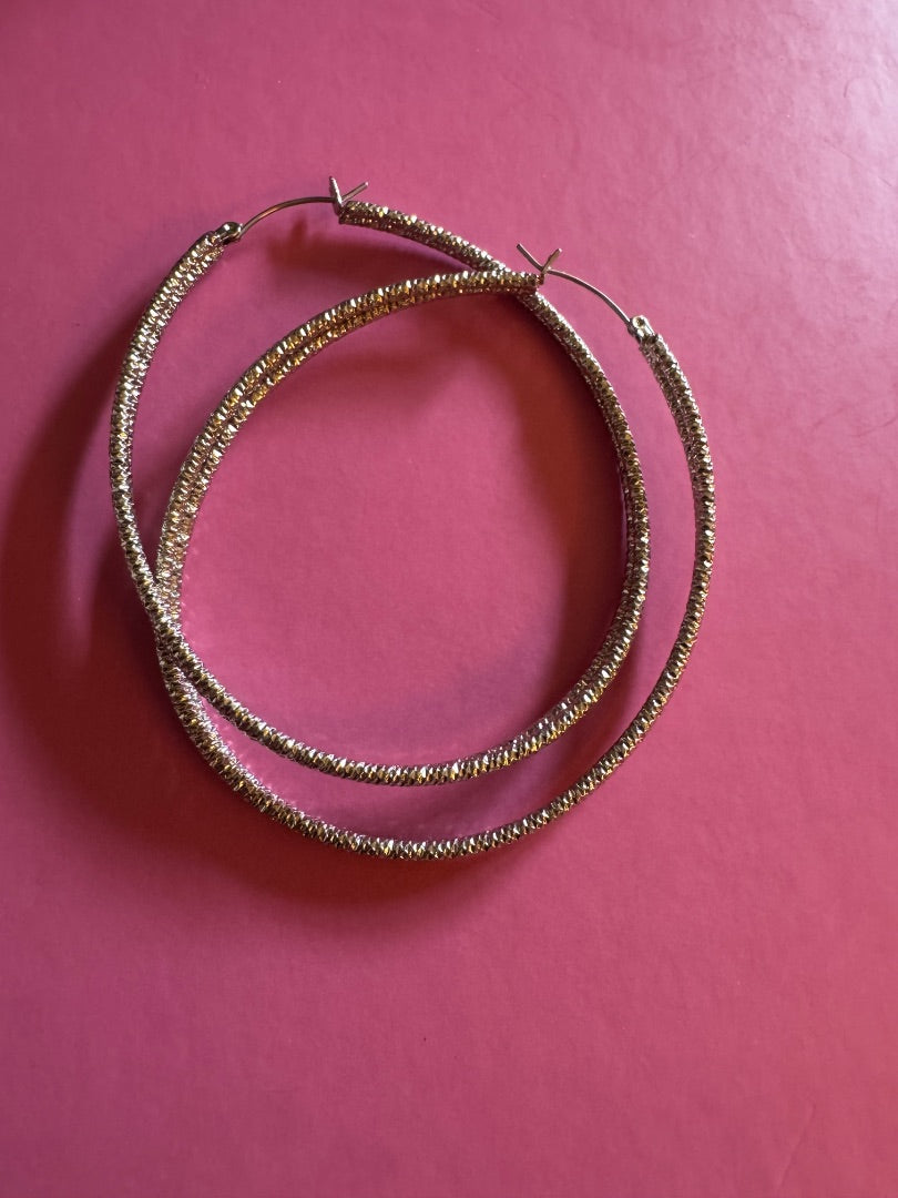 Jennifer Lopez silver tone large oval hoop earrings