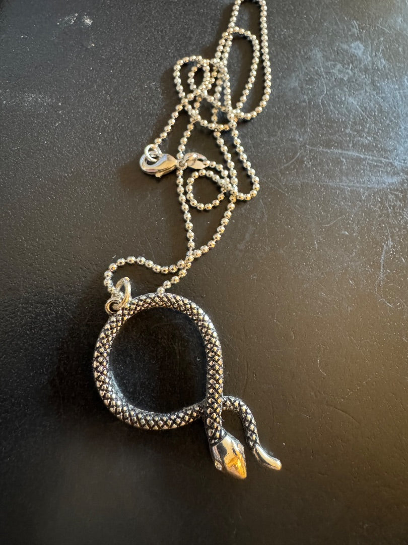 Silver tone circled snake necklace