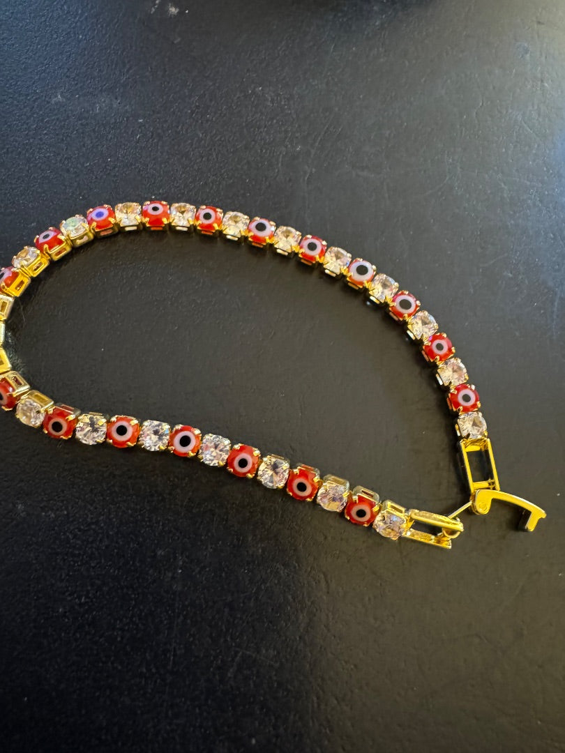 Red evil eye gold tone tennis bracelet
