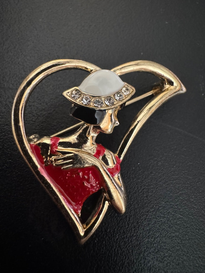 Woman red dress white hat goldtone heart brooch