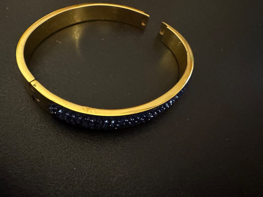 Blue rhinestone 316L S. Steel clamp bracelet gold tone