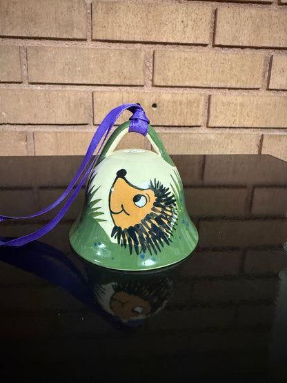 Cream MacBeth-Evans Ceramic Bell with Hedgehog, 3” tall, 3 1/2” wide