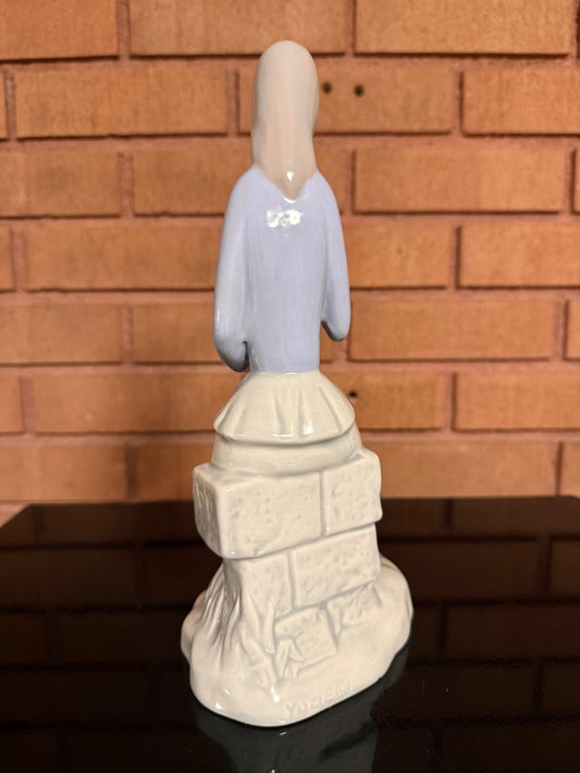 Blue and white Jullar Levante Jullar Levante Girl with Bird, 10” tall, 6” wide