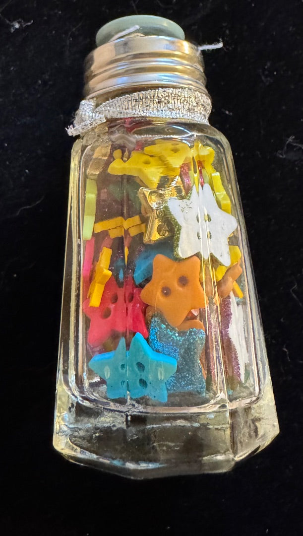 Small jar of small star buttons