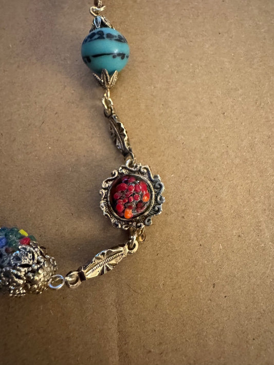 Multi color goldtone/cap double clasp necklace