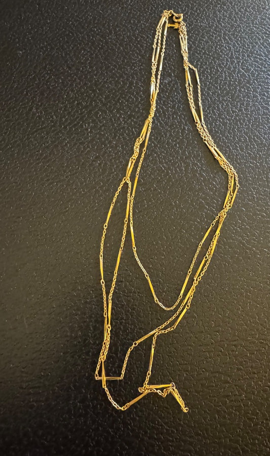 "T" goldtone multi strand necklace