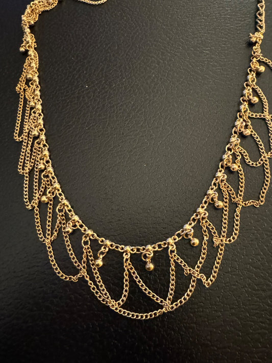 Goldtone woven design necklace