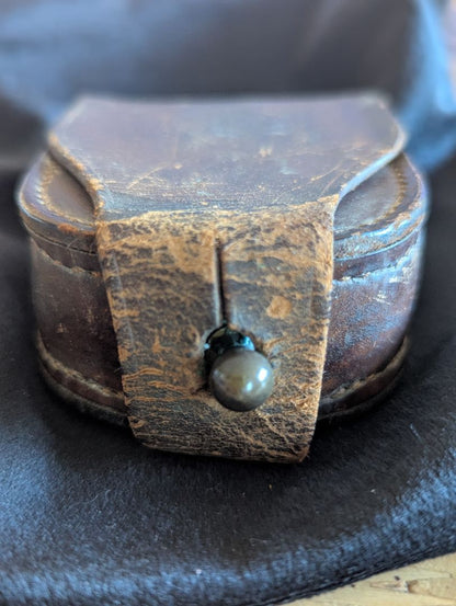Old leather pocket watch or compass case