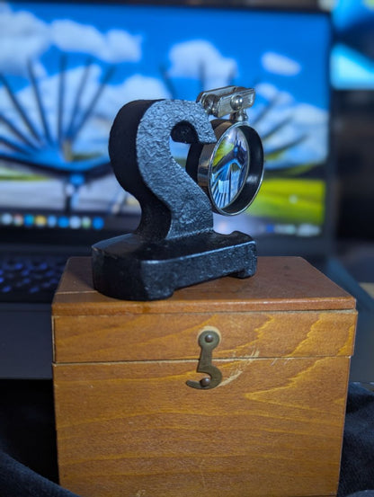 Vintage magnifyer with cast iron base and wood storage box