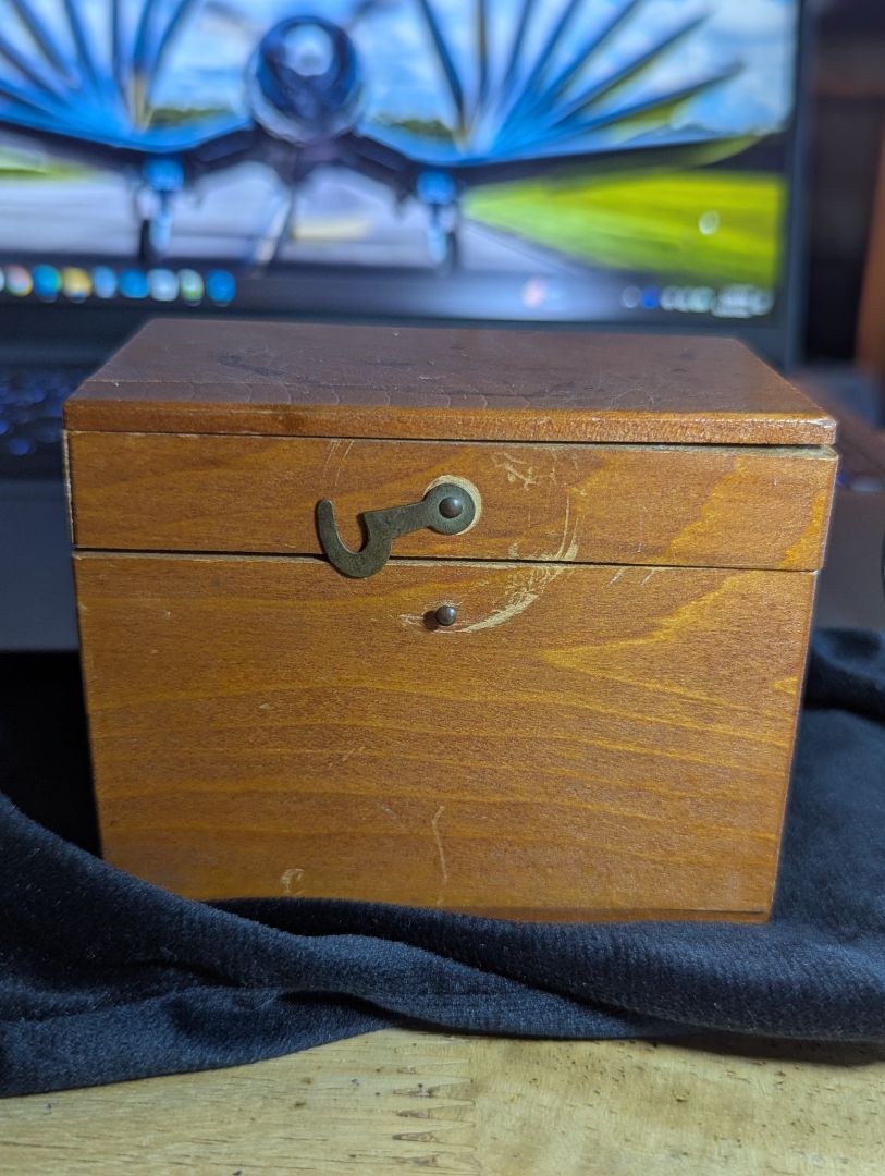 Vintage magnifyer with cast iron base and wood storage box