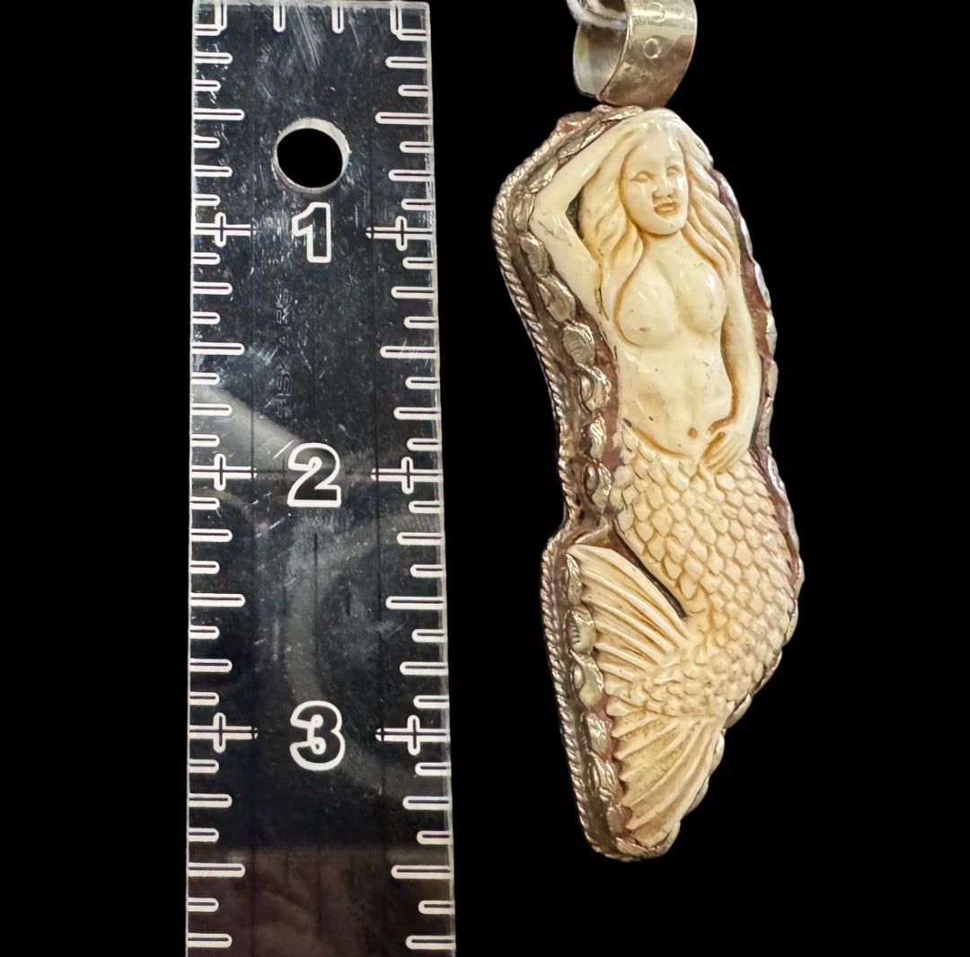 Bonecarved mermaid pendant