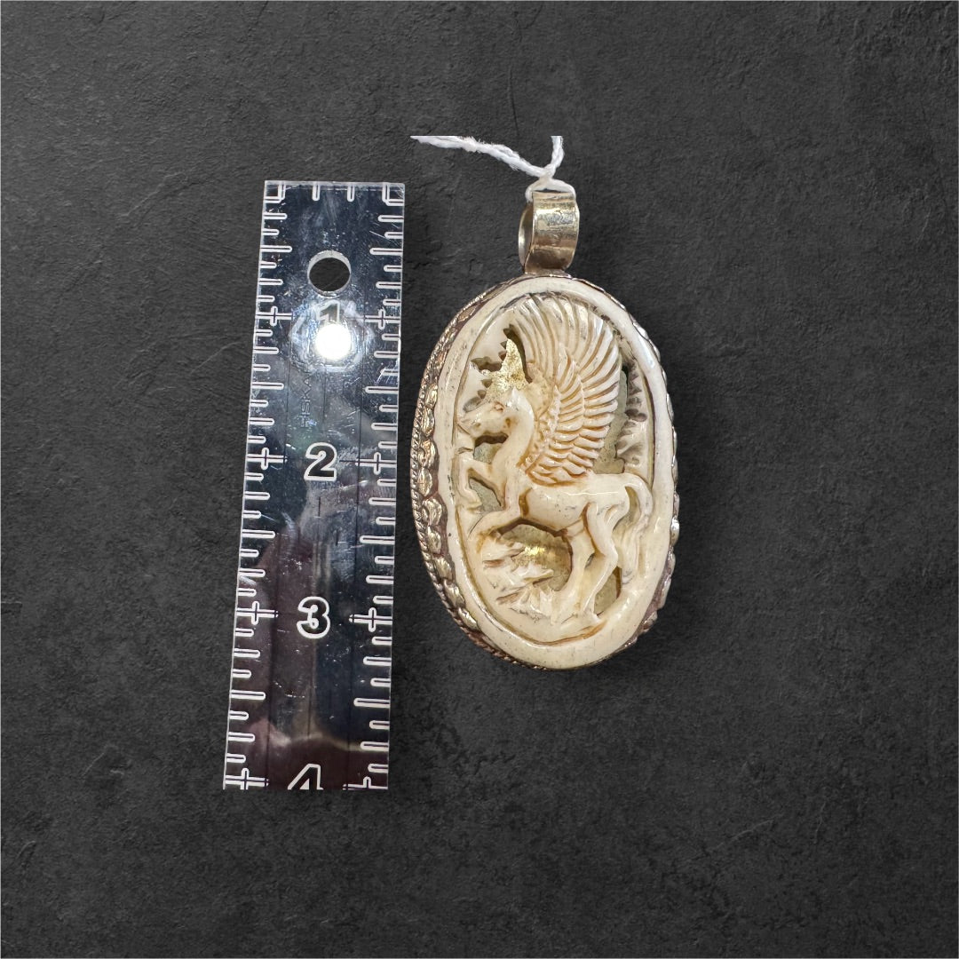 Bone carved pegasus pendant