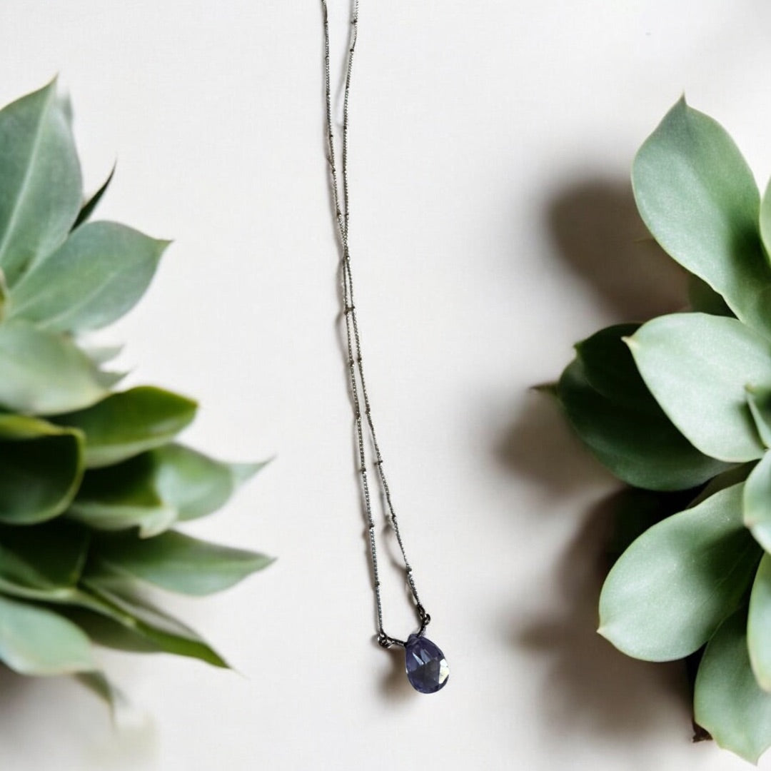 Silver tone and purple Avon Avon purple pendant silver tone necklace