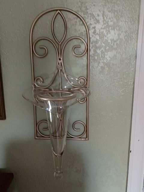 Gold metal wall sconce, glass vase