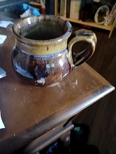 Brown, tand, with subtle hints of blue  Hand thrown pottery coffee mug