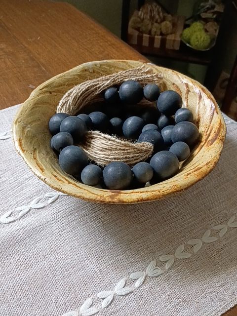 Rustic brown pottery bowl 8", black wood bead rope
