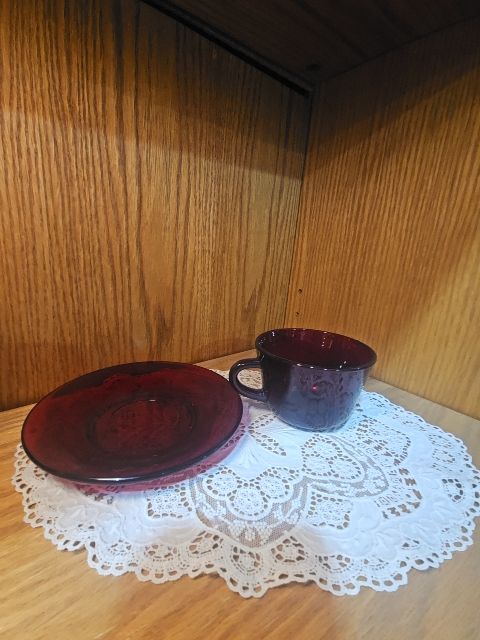 red  Red glass cup and saucer