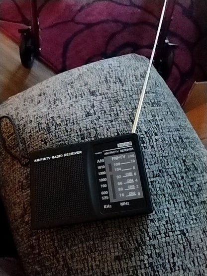 Black  Portable AM/FM Radio, 4 1/4" X 3" X 13/16"